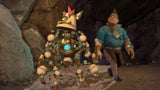 Knack 2 – skærmbillede med Knack og menneskefigur i grotte